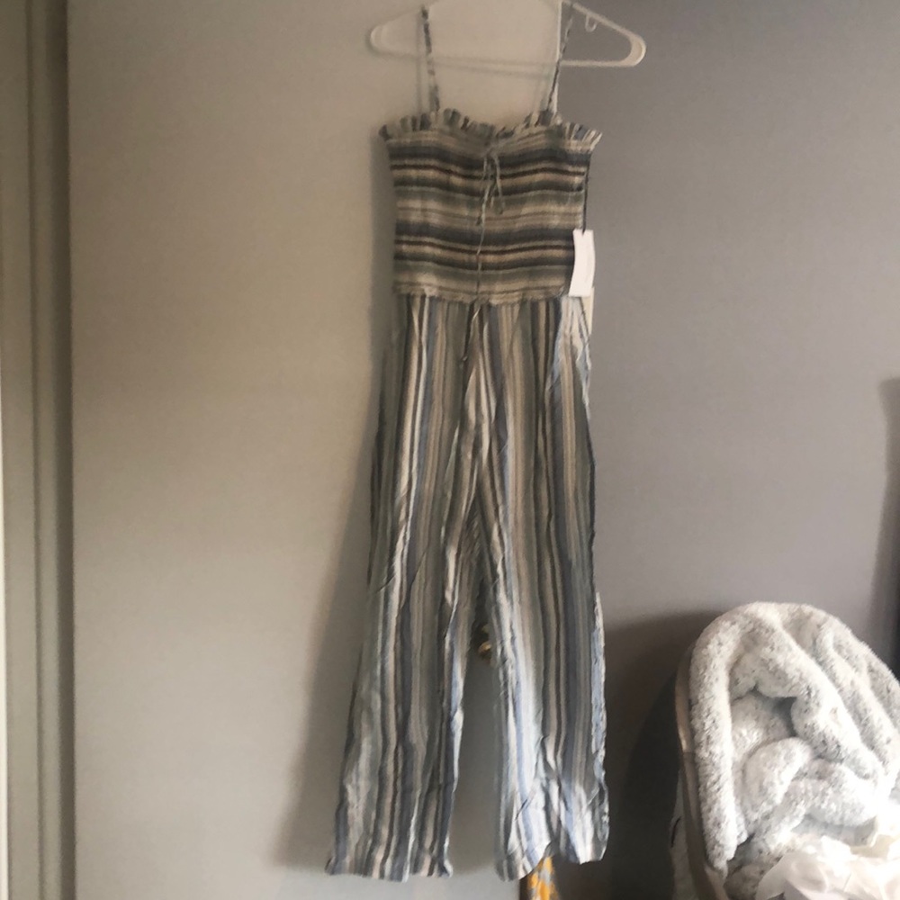 Chambray jumpsuit with smocked top and spaghetti straps